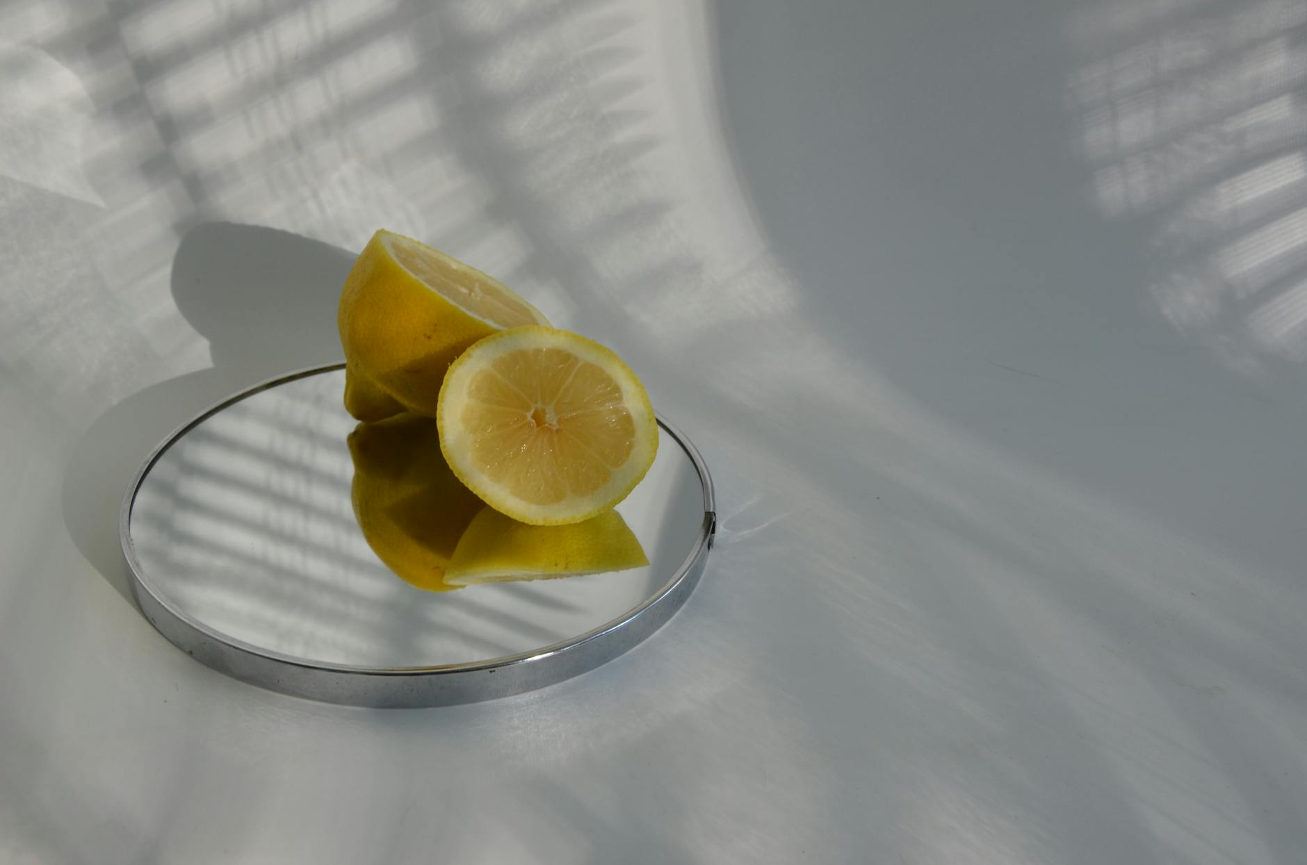 Hand holding a blue silicone lemon vibrator against a purple background, representing self-love and sexuality.